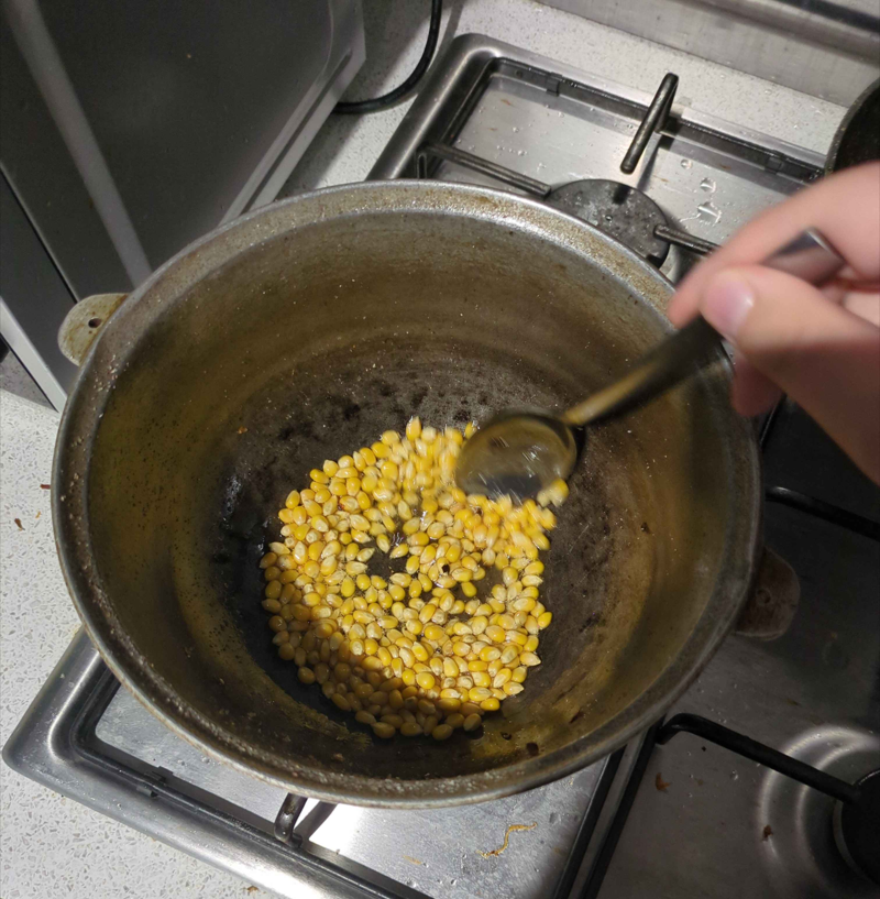 stirring the corn!
